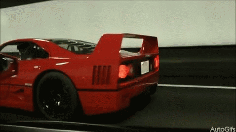 Red Sports Car Driving Down Road Autogifs GIF