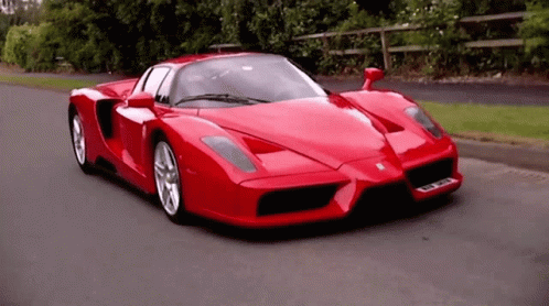 Red Sports Car Driving with GKC License Plate