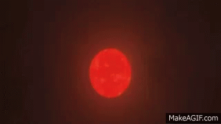 Red Sun Shining in Dark Sky