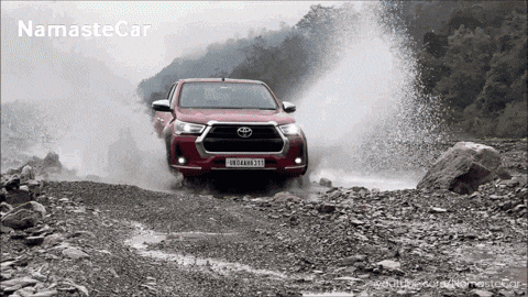 Red Toyota Truck Driving Through Muddy River With Namaste Car GIF