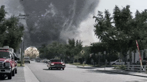 Red Truck Parked Beside Smoke Cloud