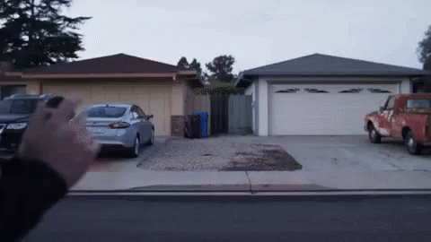 Red Truck Parked in Front of Garage