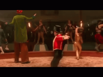 Red Uniform Man Dancing With Circus Clown Behind GIF