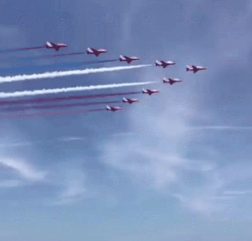 Red White And Blue Jets Flying Over A Crowd GIF