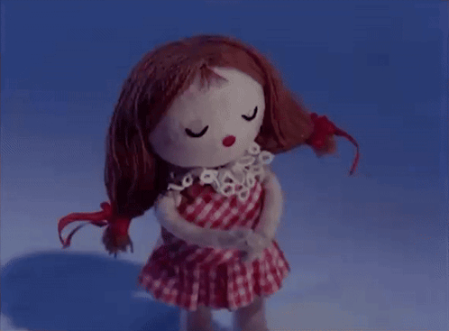 Redhead Doll in Checkered Dress Eyes Closed