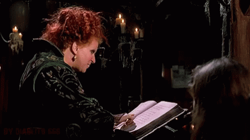 Redhead Woman Holding Book Making Funny Face