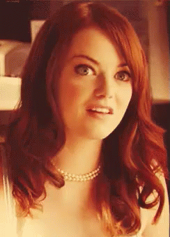 Redhead Woman in Pearl Necklace Surprised