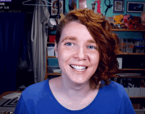 Redhead Woman Smiling at Gifted Sign
