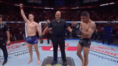 Referee Between Two Boxers In Ring GIF