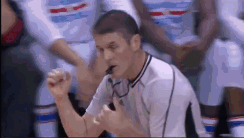 Referee Blowing Whistle in Basketball