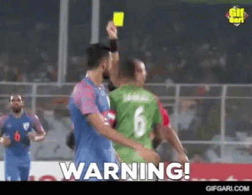 Referee Giving Yellow Card to Soccer Player