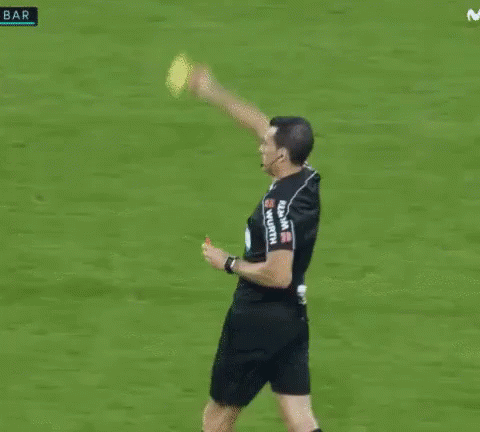 Referee Holding Yellow Card