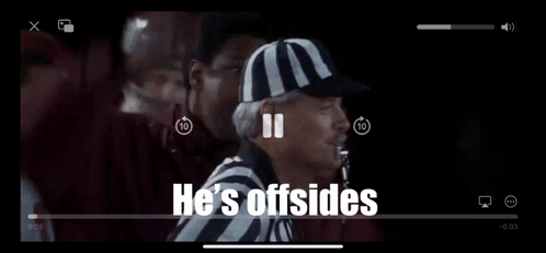 Referee in McDonald's Hat Talking to Football Players