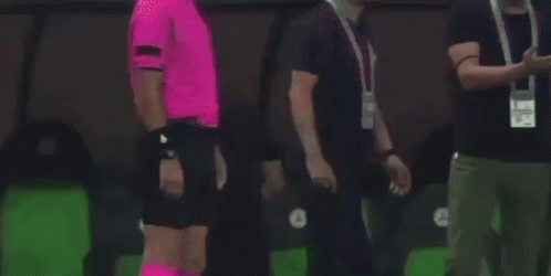 Referee In Pink Socks And Black Shoes GIF