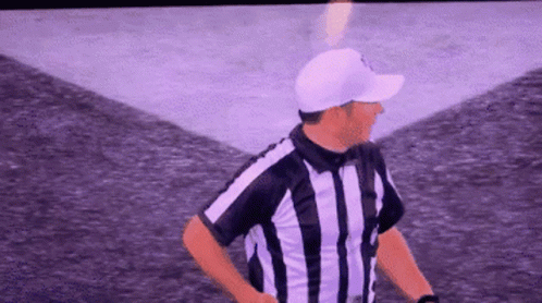 Referee in White Hat and Striped Shirt