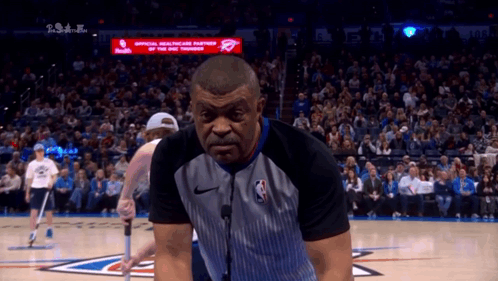 Referee On Basketball Court In Front Of Crowd GIF
