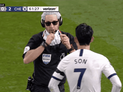 Referee Talking to Soccer Player Number 7