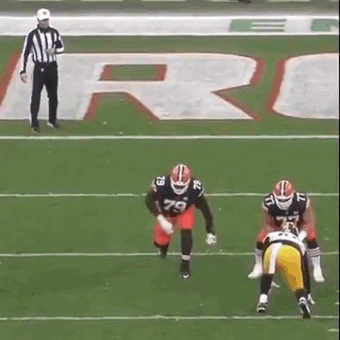 Referee Watching Two Football Players GIF