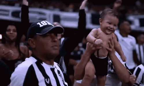 Referee Wearing Hat 181 Holding Baby GIF