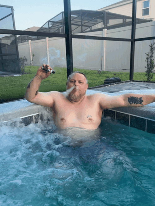 Relaxing And Smoking Cigar In Pool GIF