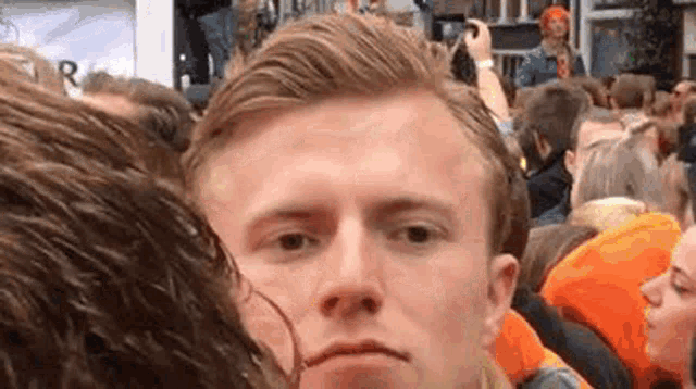 Relief Crowd Guy Sigh Reaction GIF