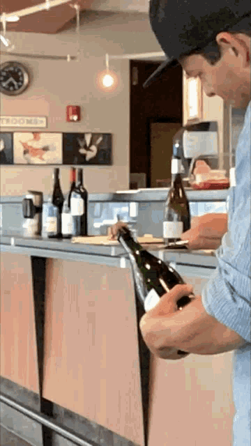 Removing Champagne Cork Using Knife GIF
