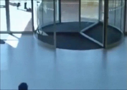 Revolving Door Glass Running Hit GIF