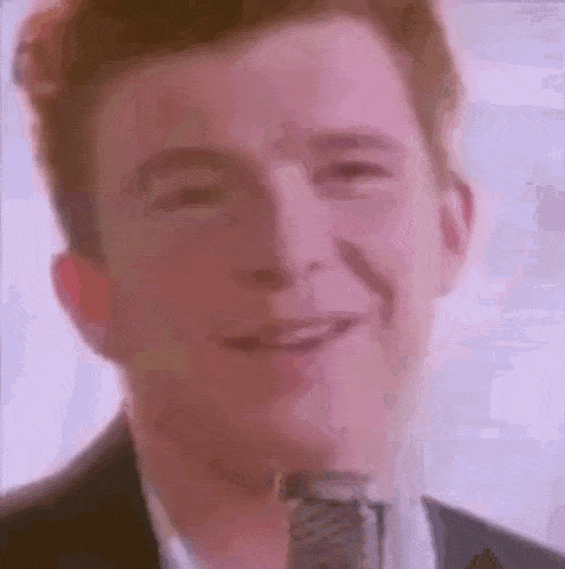 Rick Astley Singing Big Head GIF