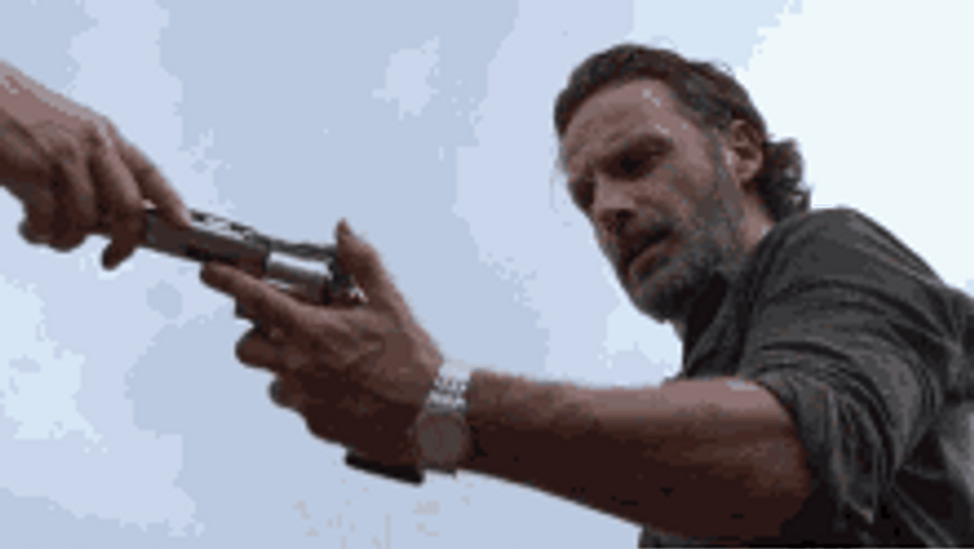 Rick Grimes Walking Dead Holding And Assessing Gun GIF