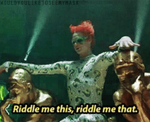 Riddle Me This Riddle Me That Is Written In Yellow Letters GIF