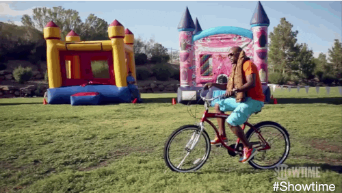 Riding Bike In The Grass GIF