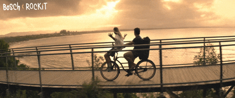 Riding Bike While The Sun Sets GIF