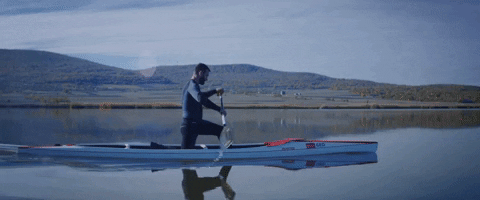 Riding The Canoe In The Plain Water GIF