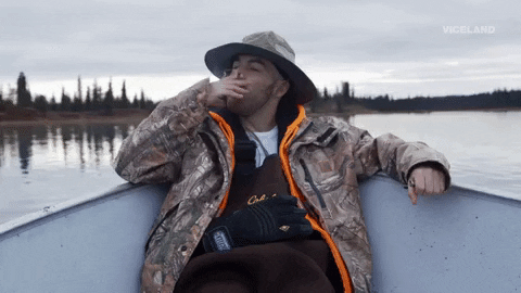 River Man Smoking On Boat GIF