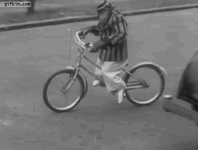 Rizz Vintage Monkey Riding Bike GIF