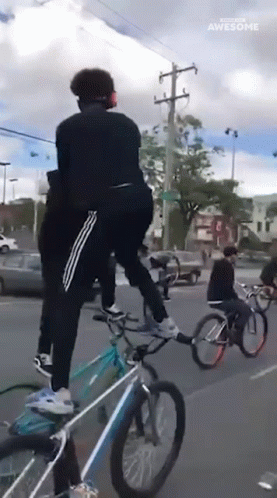 Road Show Bicycle Standing Tricks GIF