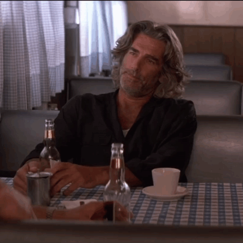 Roadhouse Wade Raising A Bottle Of Beer GIF