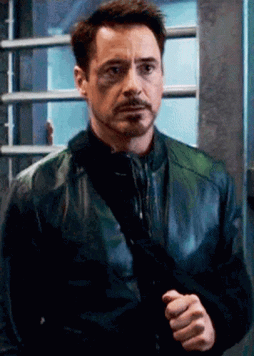 Robert Downey Jr. Holding Gun in Black Leather Jacket