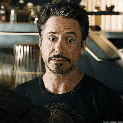 Robert Downey Jr. Is Wearing A Black Shirt That Says Sabbath On It . GIF