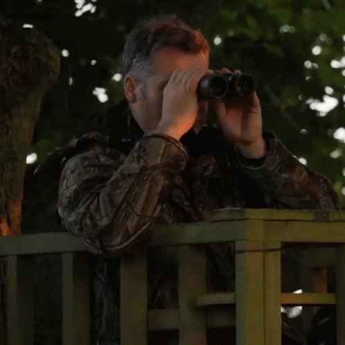 Robert Fuller Watching Thru Binoculars GIF
