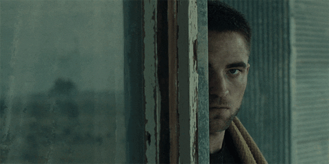 Robert Pattinson Peeking Behind Wall GIF