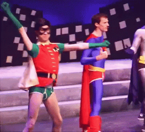 Robin And Superman Are Dancing Together On Stage GIF