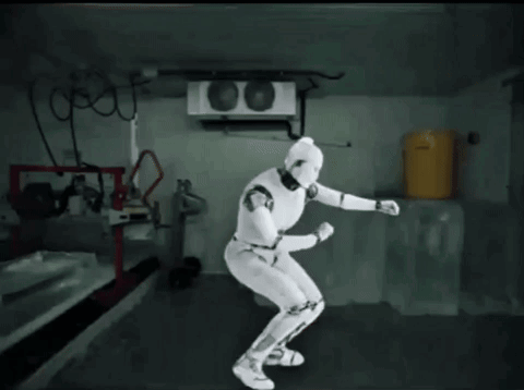 Robot Dancing Behind Yellow Barrel