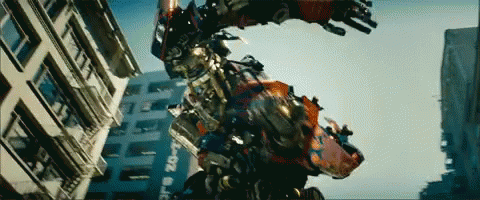Robot Flying Past Building Saying 20-1