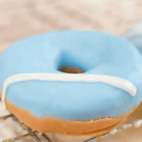Robot Holding Donut with Donuts Sign