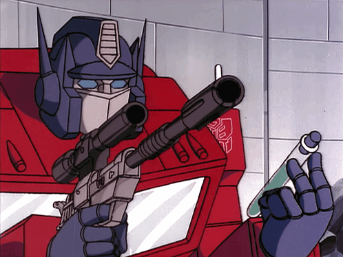 Robot Holding Gun With Transformers Chest