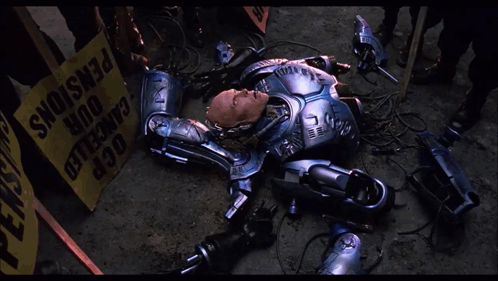 Robot Laying in Front of Yellow Box Saying OCR
