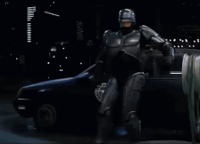 Robot Next to Car Saying Drop It