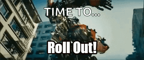 Robot Says Time To Roll Out In Front Of Building