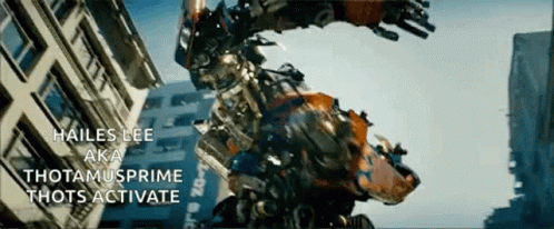 Robot Standing in Front of Building Saying Hailes Lee Aka Thotamusprime Thots Activate